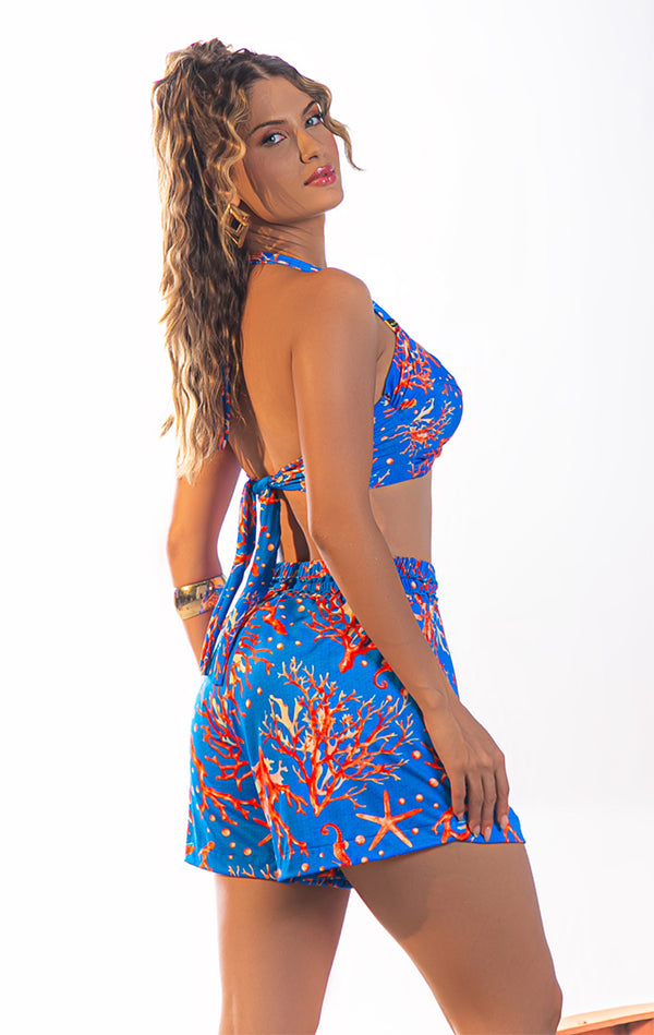 Top de biquíni azul royal com padrões de coral